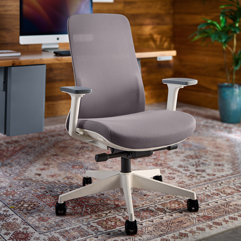 Bolan Ergonomic Chair by UPLIFT Desk at a conference table.