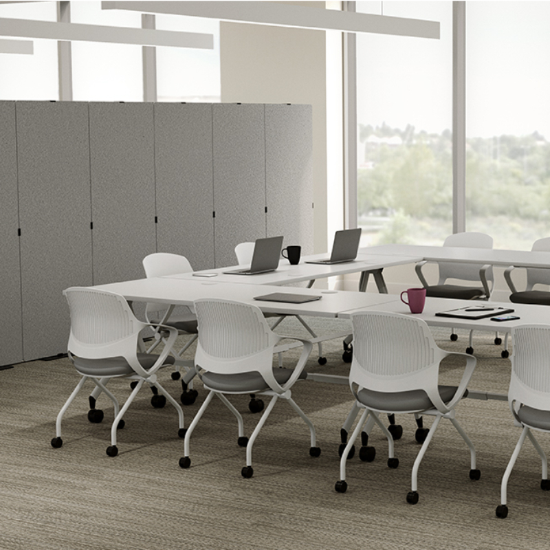 Rollaway Nesting Chairs by UPLIFT Desk set up in a conference room.