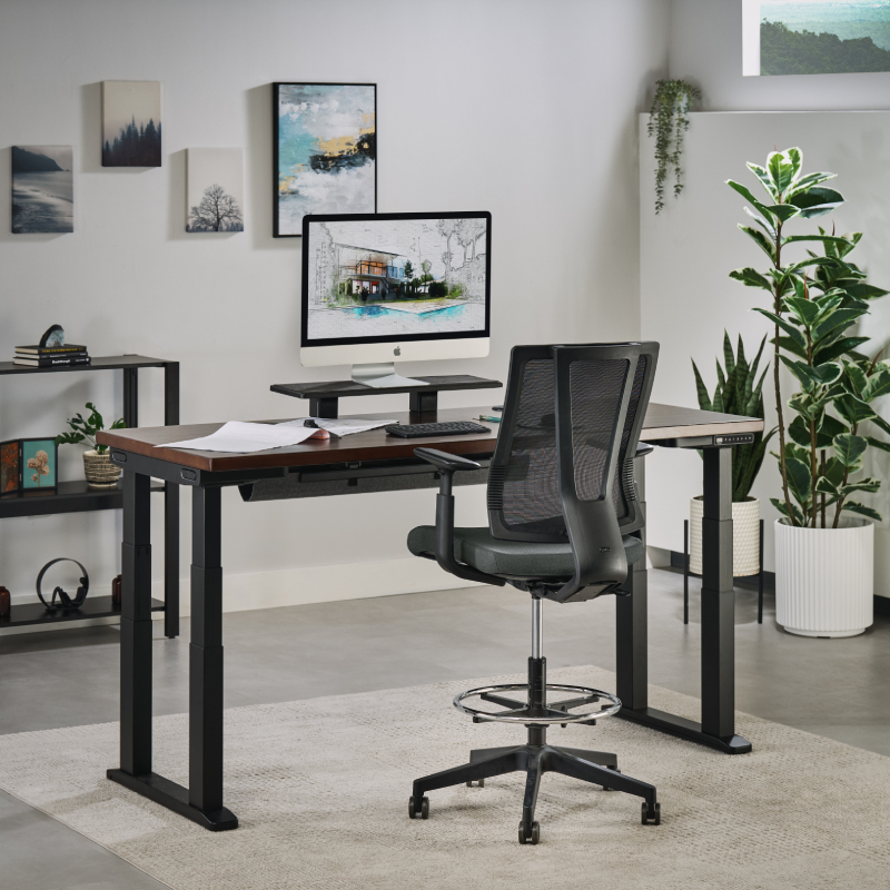 The Clarksville Ergonomic Drafting Chair in front of a 4-Leg Standing Desk by UPLIFT Desk raised to standing height.