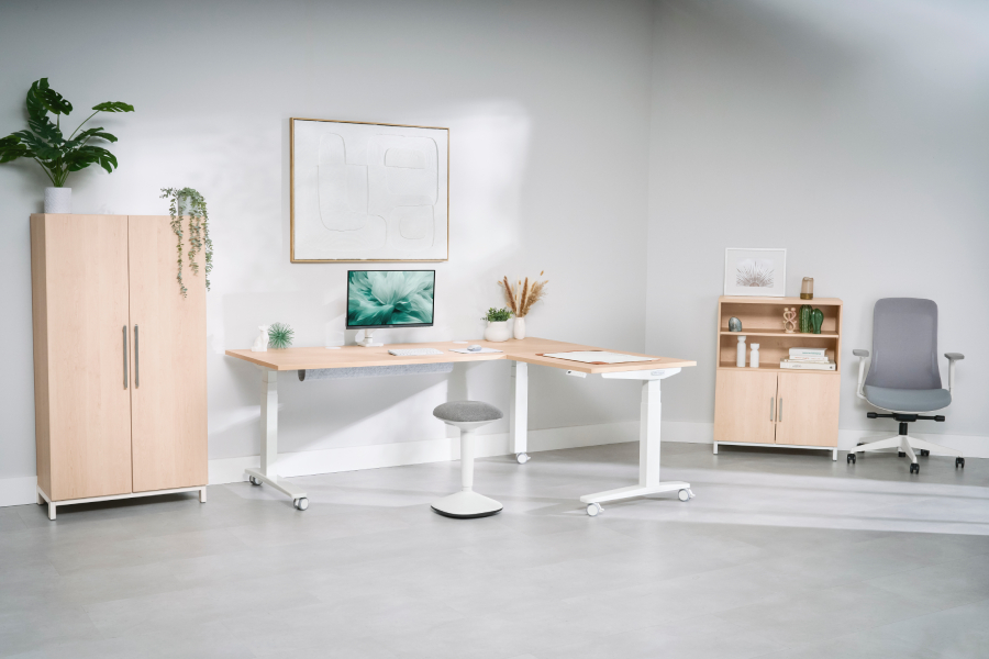 Maple L-shaped desk with Mopac storage, an Engage stool, and a Bolan chair.