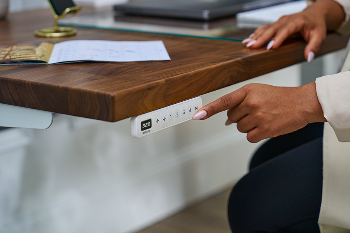 UPLIFT Desk Advanced keypad mounted on a standing desk.