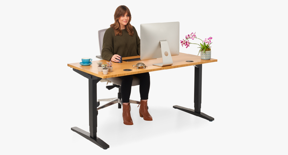 Someone working at a height adjustable desk while seated
