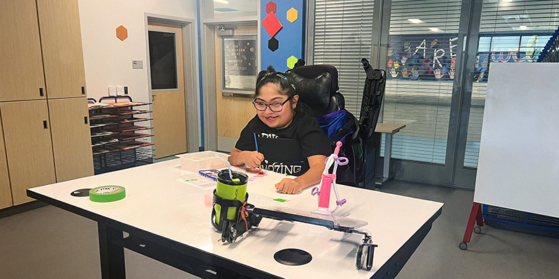 Students at Rosedale School using UPLIFT Desk height-adjustable desks with whiteboard surfaces in their learning environment.