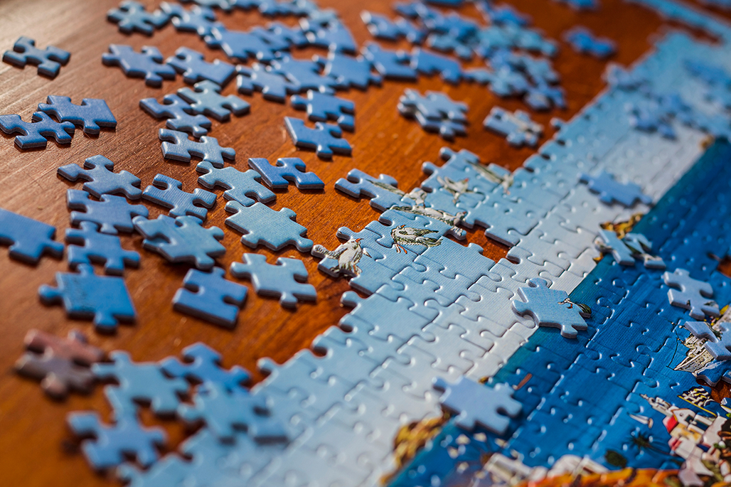 Incomplete puzzle on a standing desk.