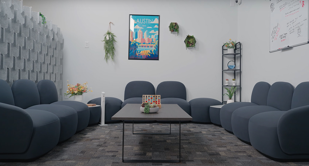 Break lounge featuring Dillo Lounge Seating and Bonnell Acoustic Puzzle Wall by UPLIFT Desk, creating a cozy and relaxing space.