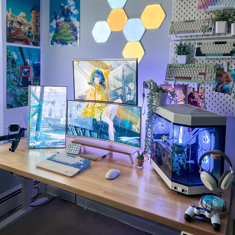 Rubberwood Uplift Desk demonstrating weight capacity supporting a computer and various accessories.