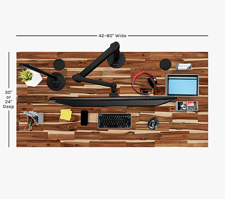 Overhead view of UPLIFT standing desk showing 42-80 inch width and 24-30 inch depth measurements with desk accessories.