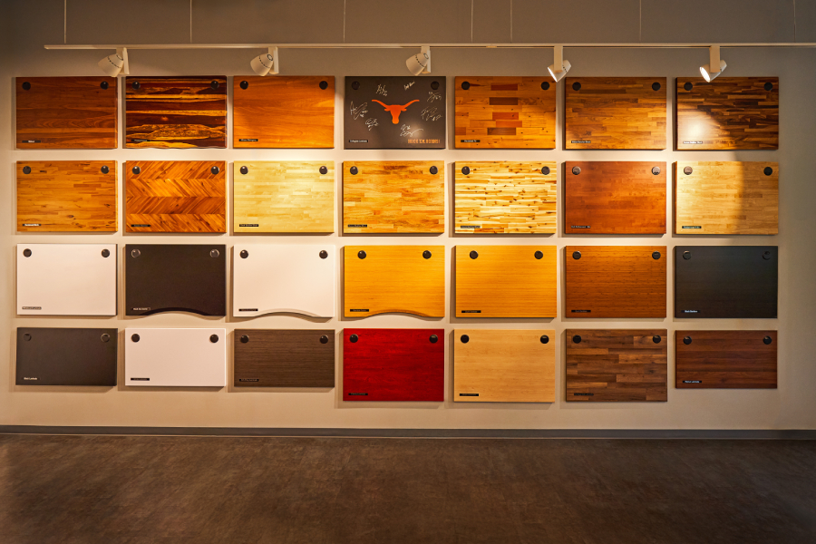 Wall of desktop finishes on display in the UPLIFT Desk showroom