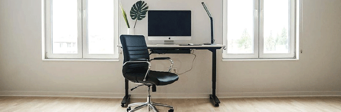 Example of an ergonomic desk setup with a chair and monitor