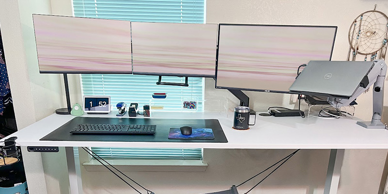 Moms RISE ATX team members using UPLIFT Desk ergonomic office furniture in their home office environments.