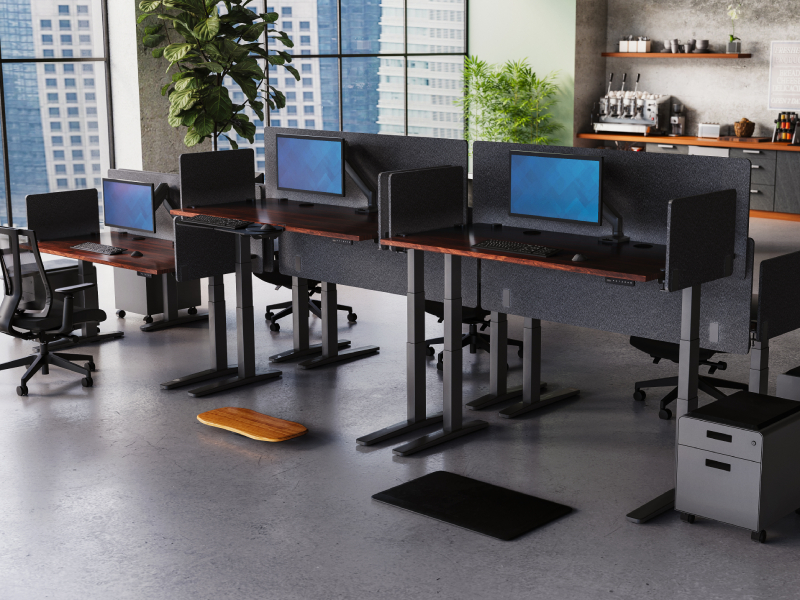 Modern office space outfitted with UPLIFT Desk business solutions, including desks, seating, and collaborative work areas.
