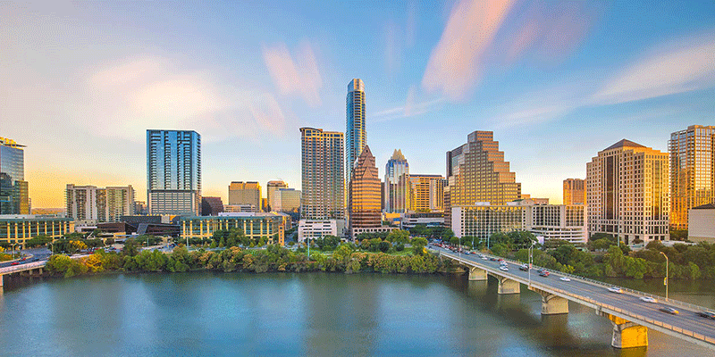 Downtown Austin skyline showcasing the congress bridge and ladybird lake.