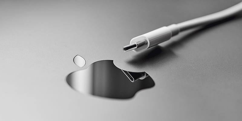 Prominent Apply logo and a USB-C cable.