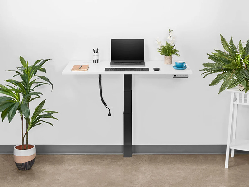 UPLIFT wall-mounted standing desk in compact space