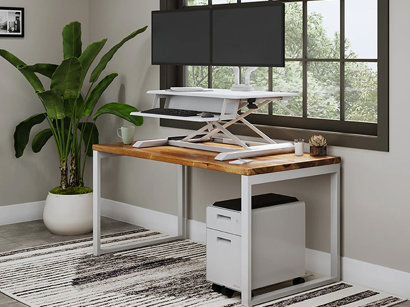 UPLIFT standing desk converter on existing desk