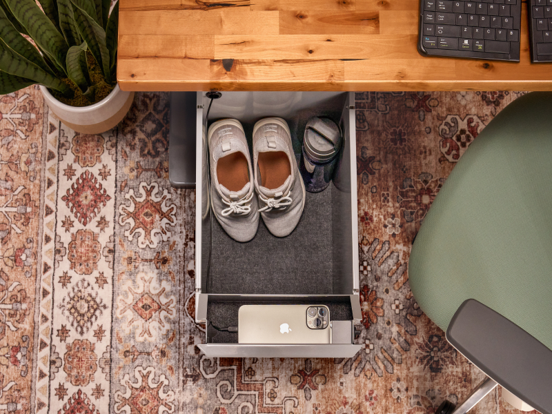 Deep Desk Drawer storing shoes and personal items in the main compartment