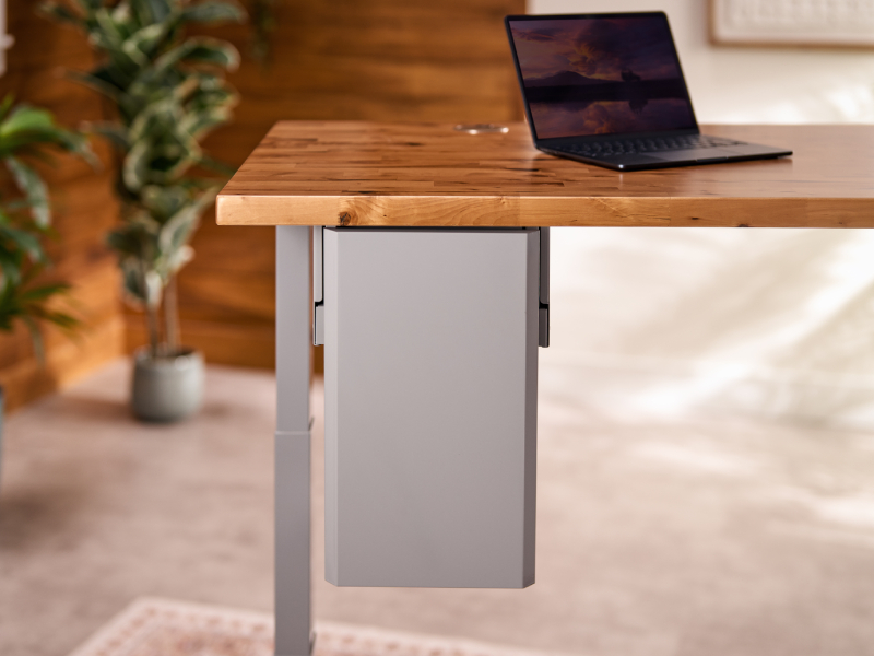 Deep Desk Drawer mounted under a standing desk in a workspace environment
