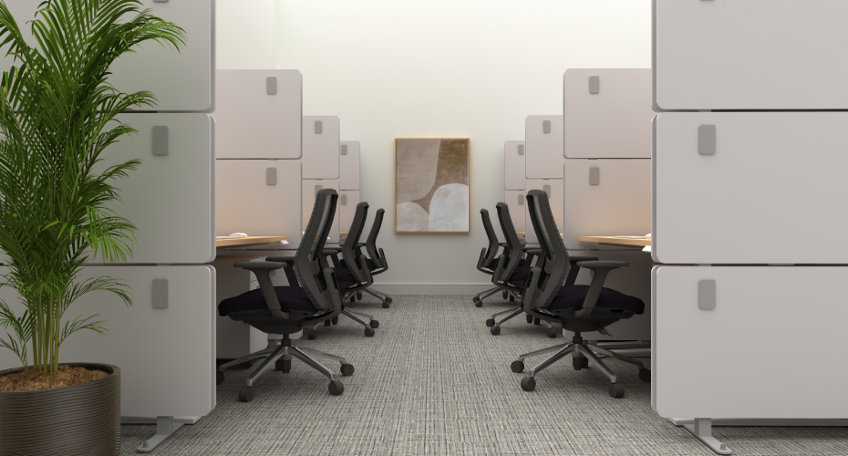 Open office workspace with properly spaced desks and acoustic panels