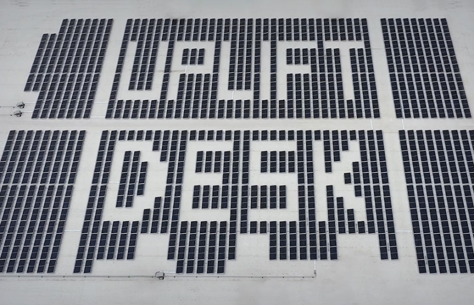 Solar panels installed on the rooftop of the UPLIFT Desk Austin facility