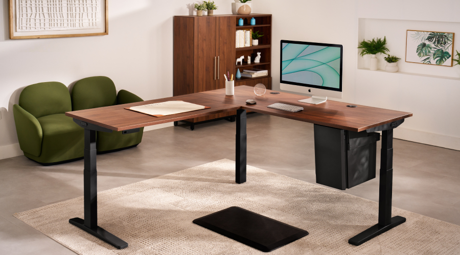 The UPLIFT L-Shaped Standing Desk, built on the V3 frame, in an L-shaped workspace