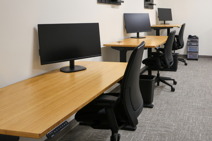 UPLIFT standing desks in the staff workspace at the Center for Child Protection's St. Johns Therapy location