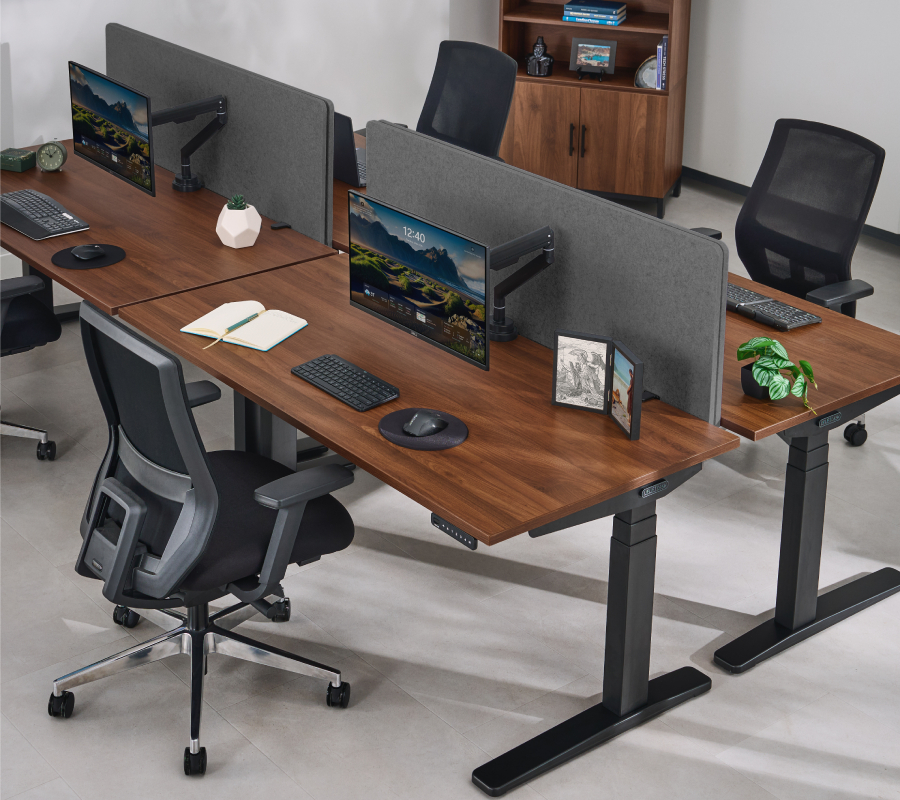 UPLIFT Standing Desks in a workspace.