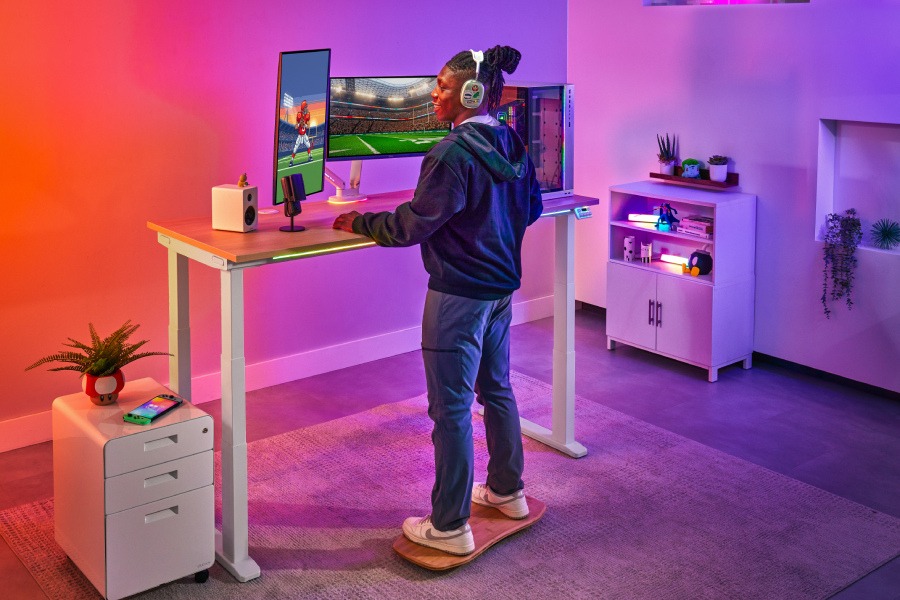 An UPLIFT 4-Leg Standing Desk set up as a gaming workstation