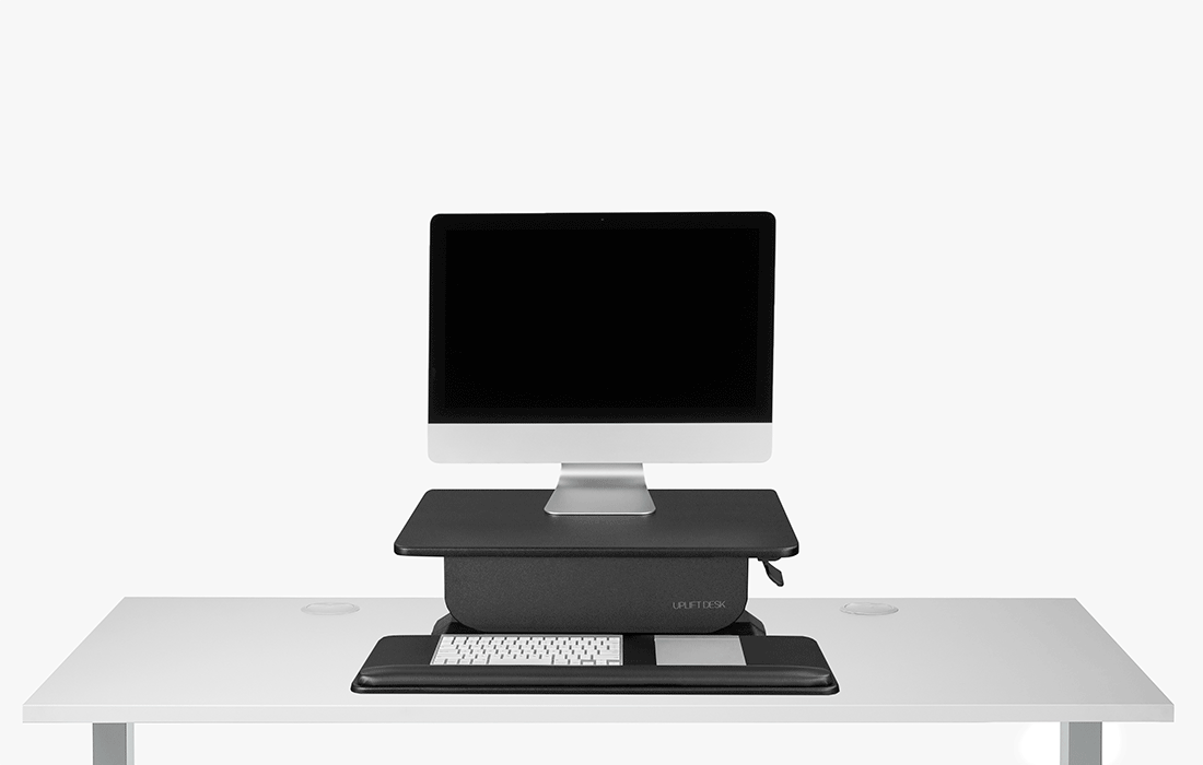 A GIF showing the Riser or Clamp Standing Desk Converter in seated and standing position
