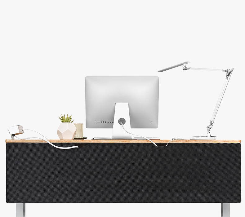 A reverse view of a 60 x 30 Bamboo Standing Desk with a Clamp-On Power with USB and a black Modesty Panel with Wire Management