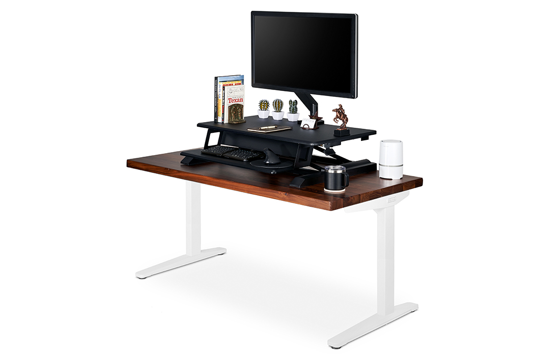 A Lady Bird Standing Desk Converter on top of a Saman Solid Wood Seated Height Side Table