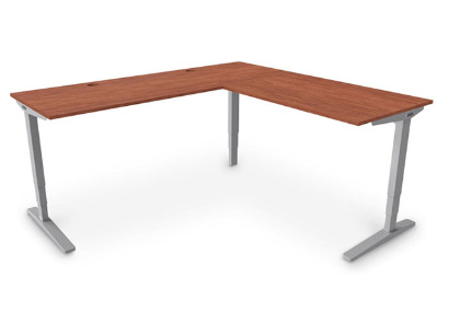 Ergonomic UPLIFT L-Shaped Standing Desk with gray frame and Wild Cherry Custom Laminate Desktop