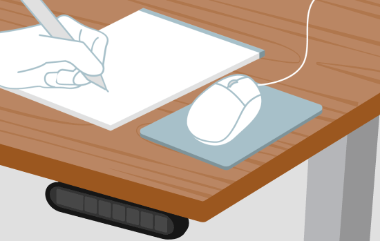 A hand draws on a notepad to protect the desktop from scratches and indentations