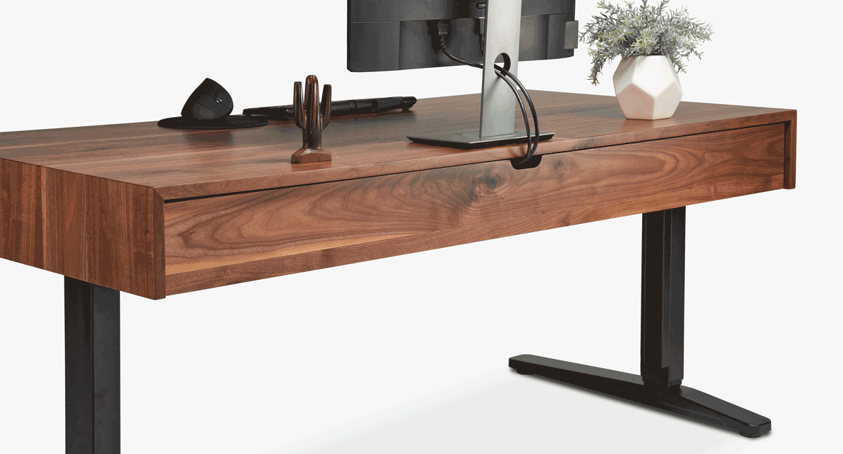 Animation of wire management compartment in rear of narrative sit stand desk with storage