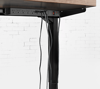 Messy cables under a desk become neatly organized using a magnetic cable organizer in a before-and-after comparison