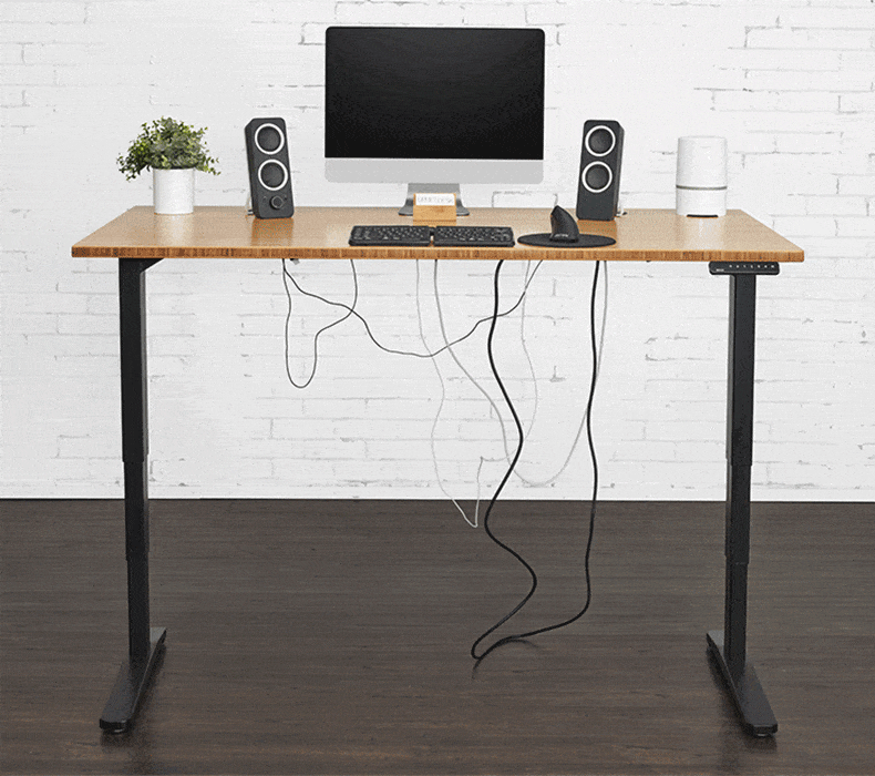 A white cable is neatly tucked away in the mesh pouch of an UPLIFT Desk Modesty Panel with Wire Management.