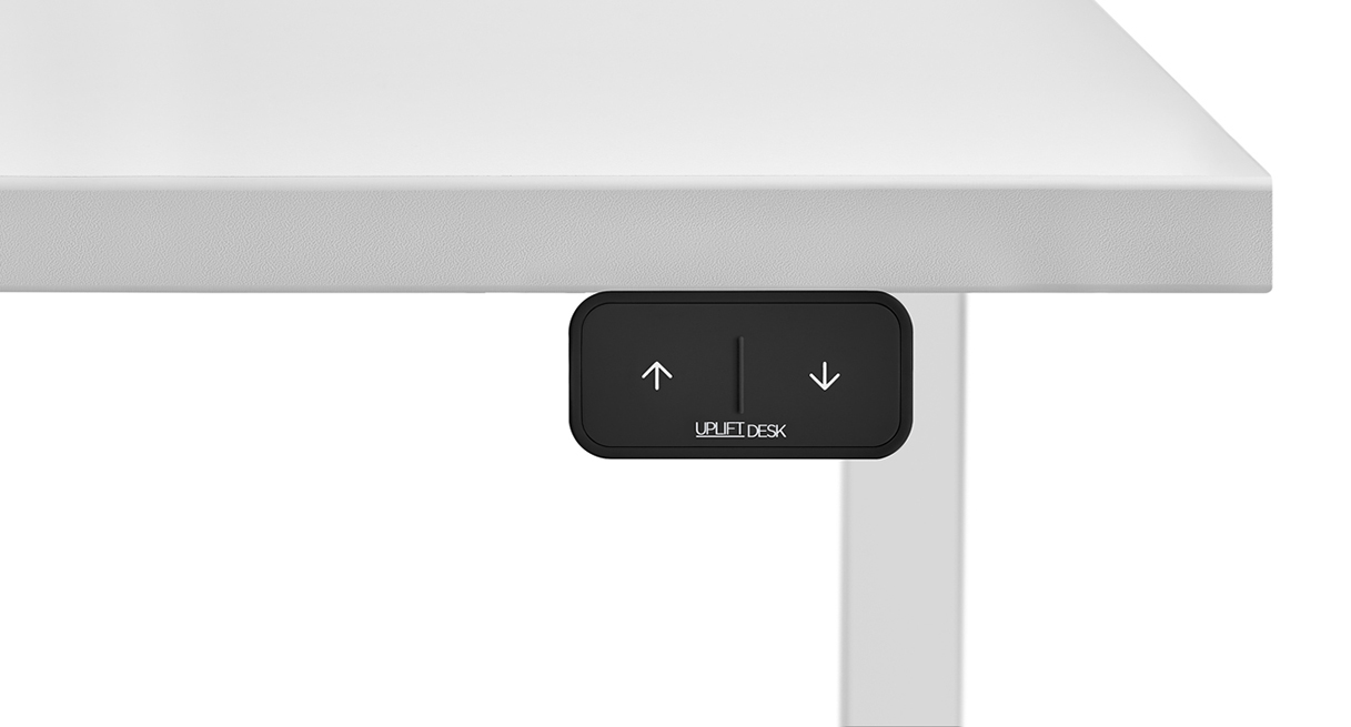 Press-and-hold the up or down arrows to adjust the desk height
