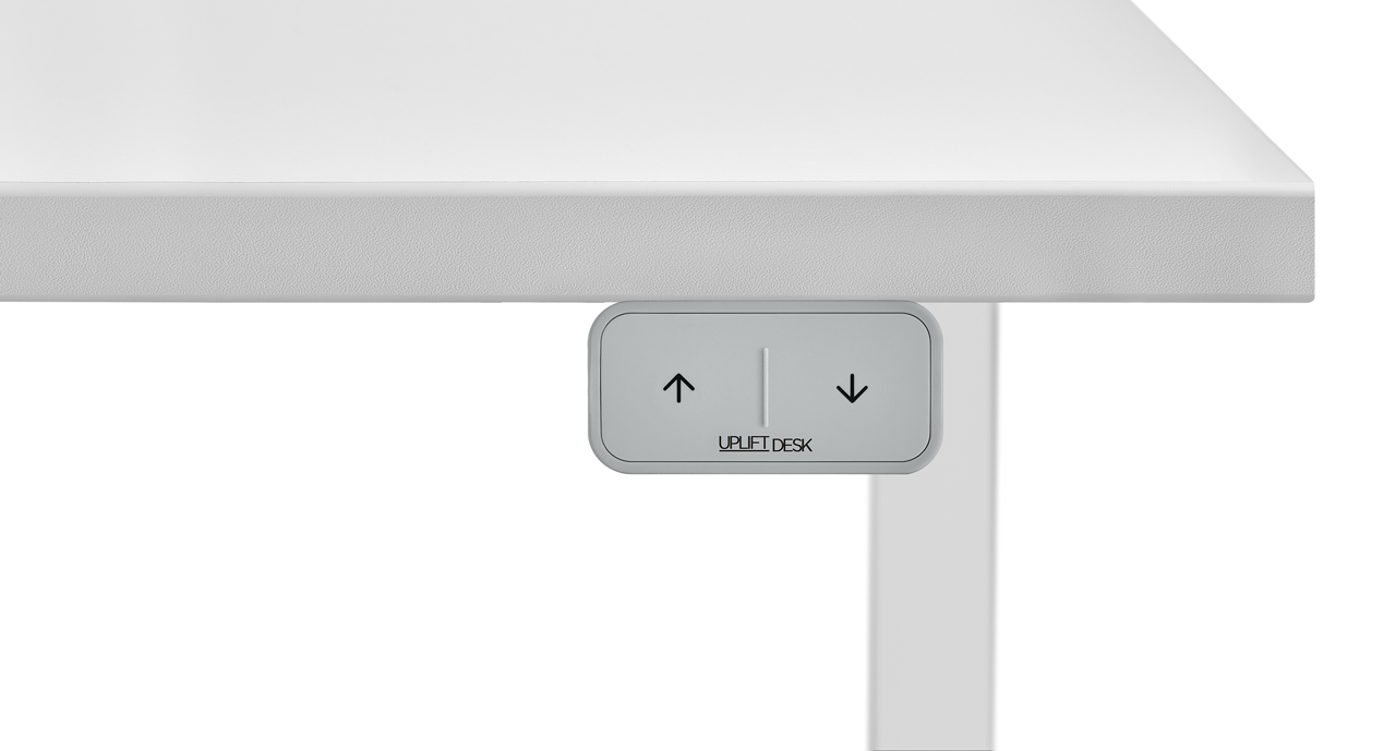 Press-and-hold the up or down arrows to adjust the desk height