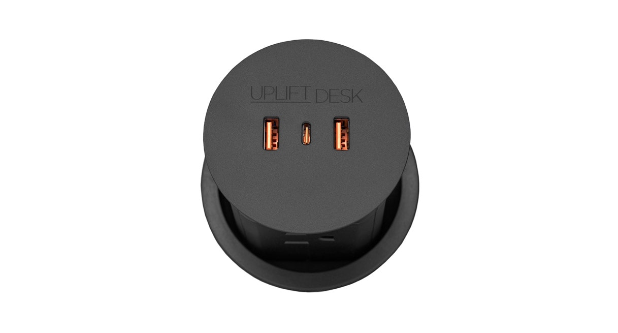Press down on the top surface to raise the unit and access the four 120V power outlets
